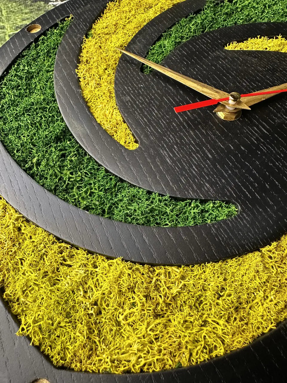 Spiral wall clock handcrafted from ash wood and moss