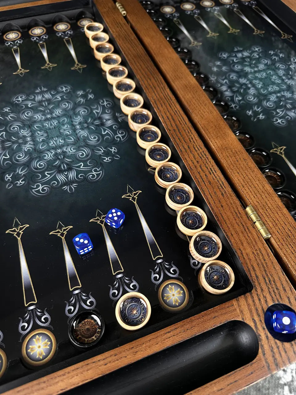 Detailed view of resin inlaid game pieces on backgammon board