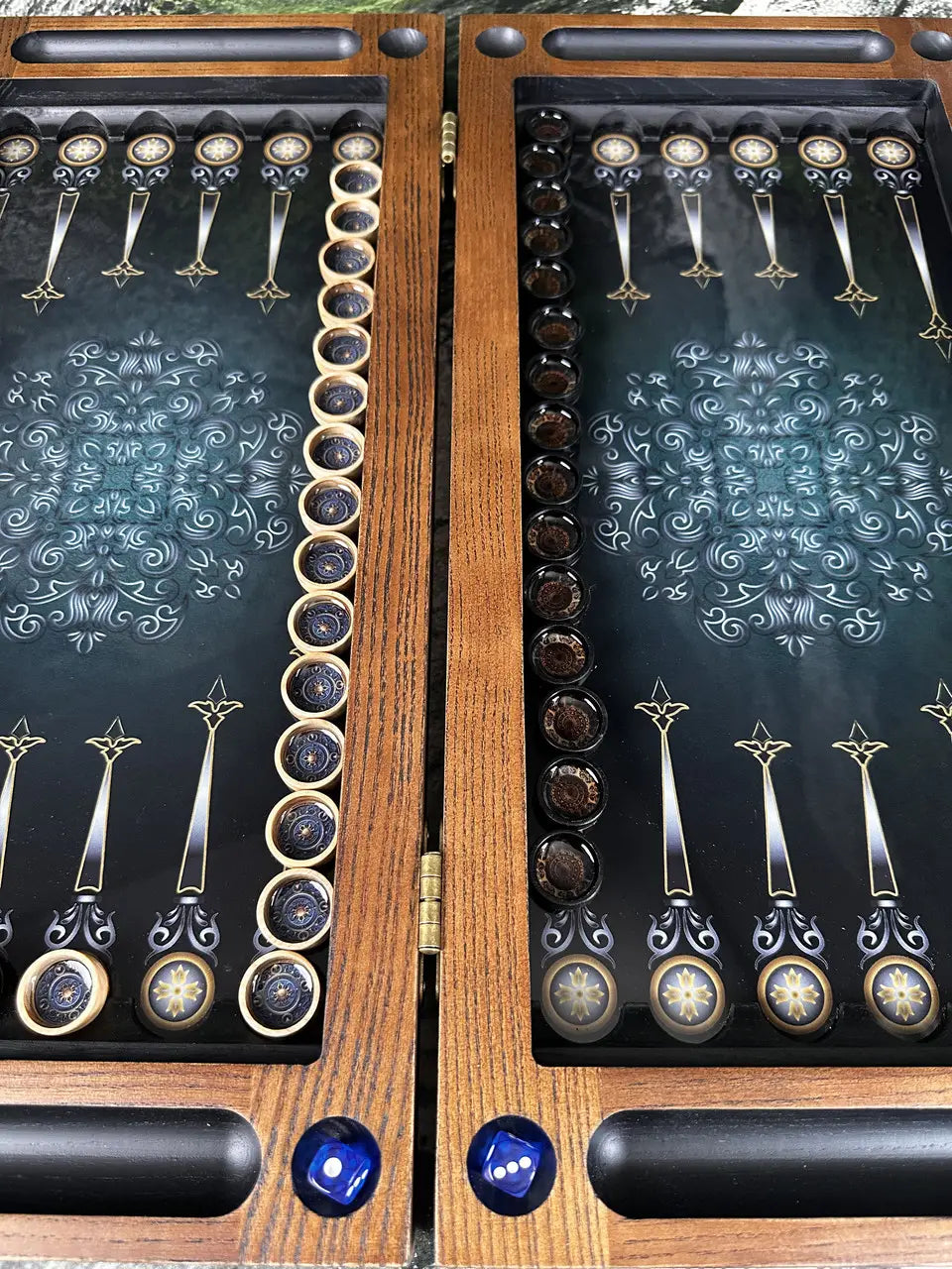 Backgammon pieces and dice inside wooden game set