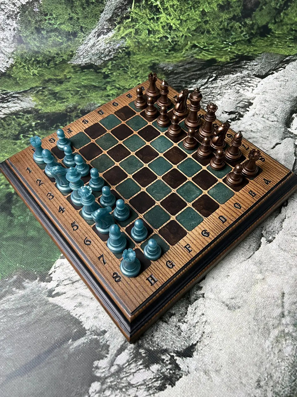 Premium wooden chess set with bronze and teal resin pieces arranged for play