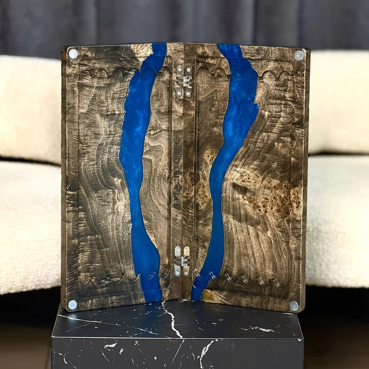 Natural wood backgammon board with flowing blue epoxy design