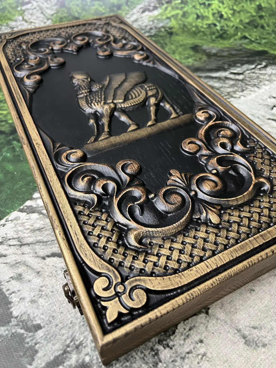 Carved Shedu guardian relief on handcrafted wooden backgammon case