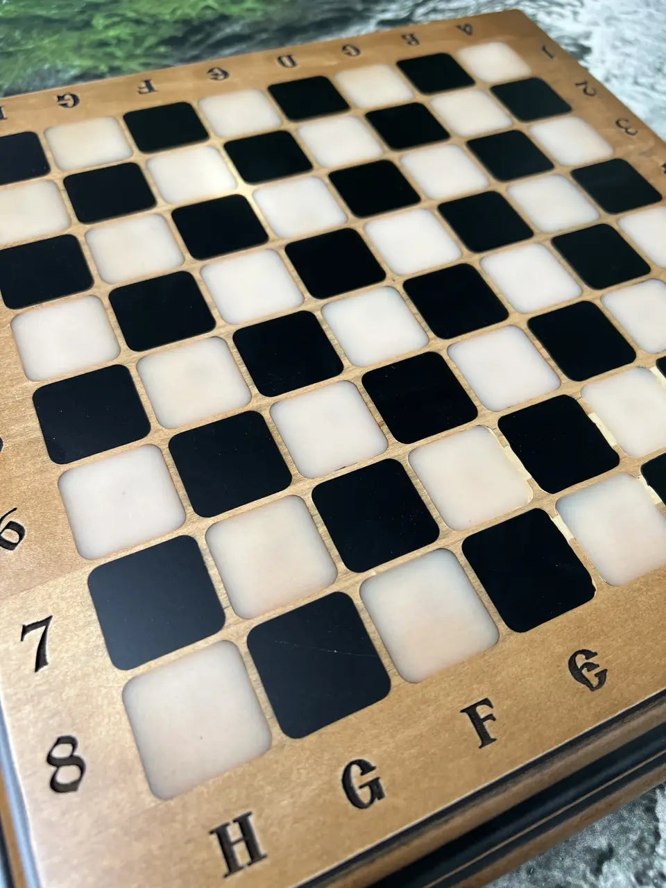 Luxury ash wood chess board with epoxy resin pieces