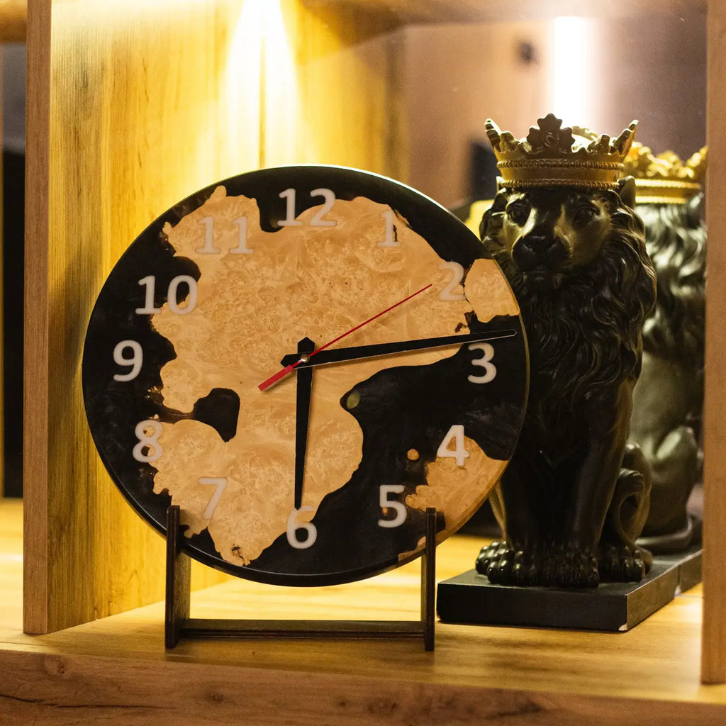 Handmade epoxy resin wall clock crafted from natural poplar burl.