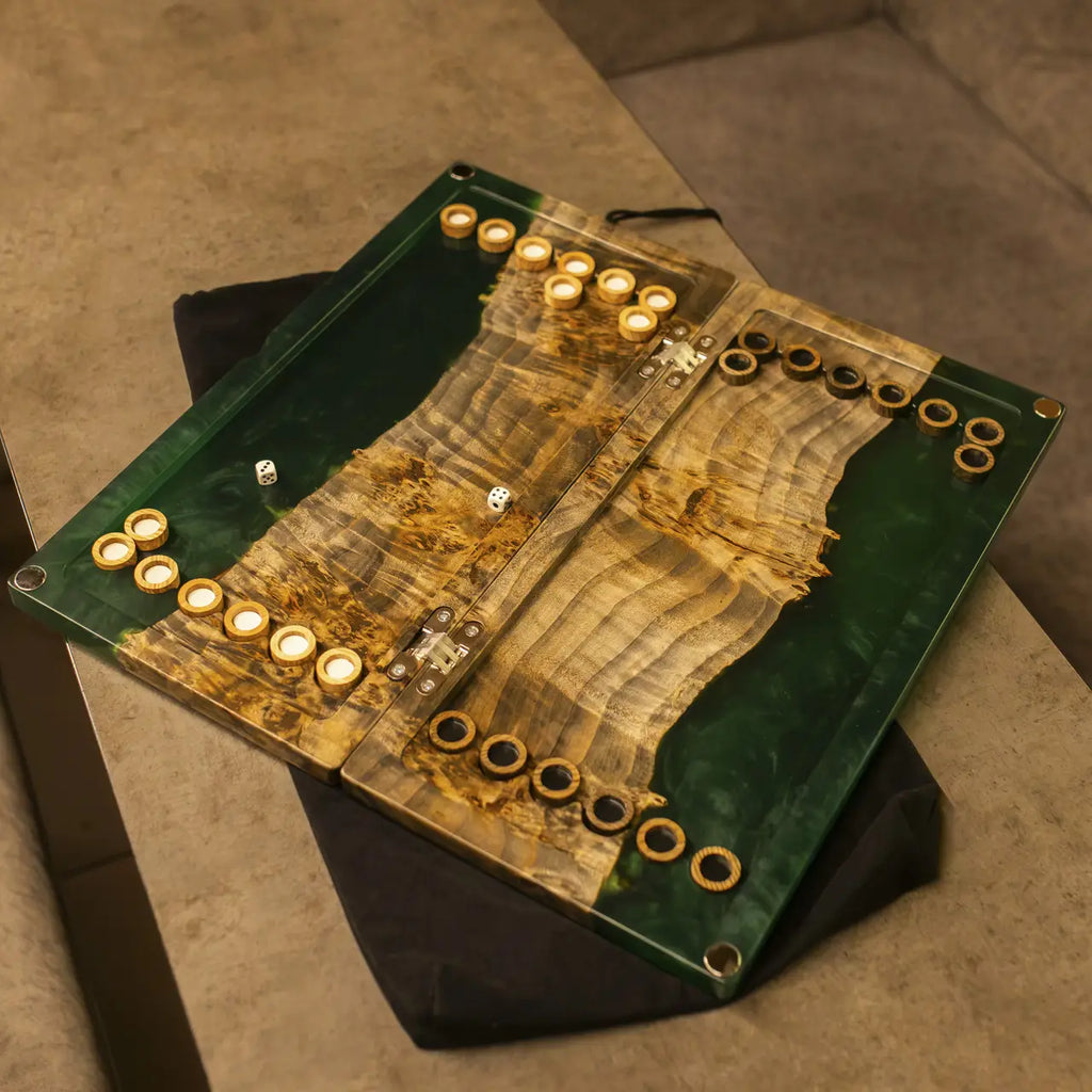 Close-up of natural wood grain and green epoxy resin backgammon board