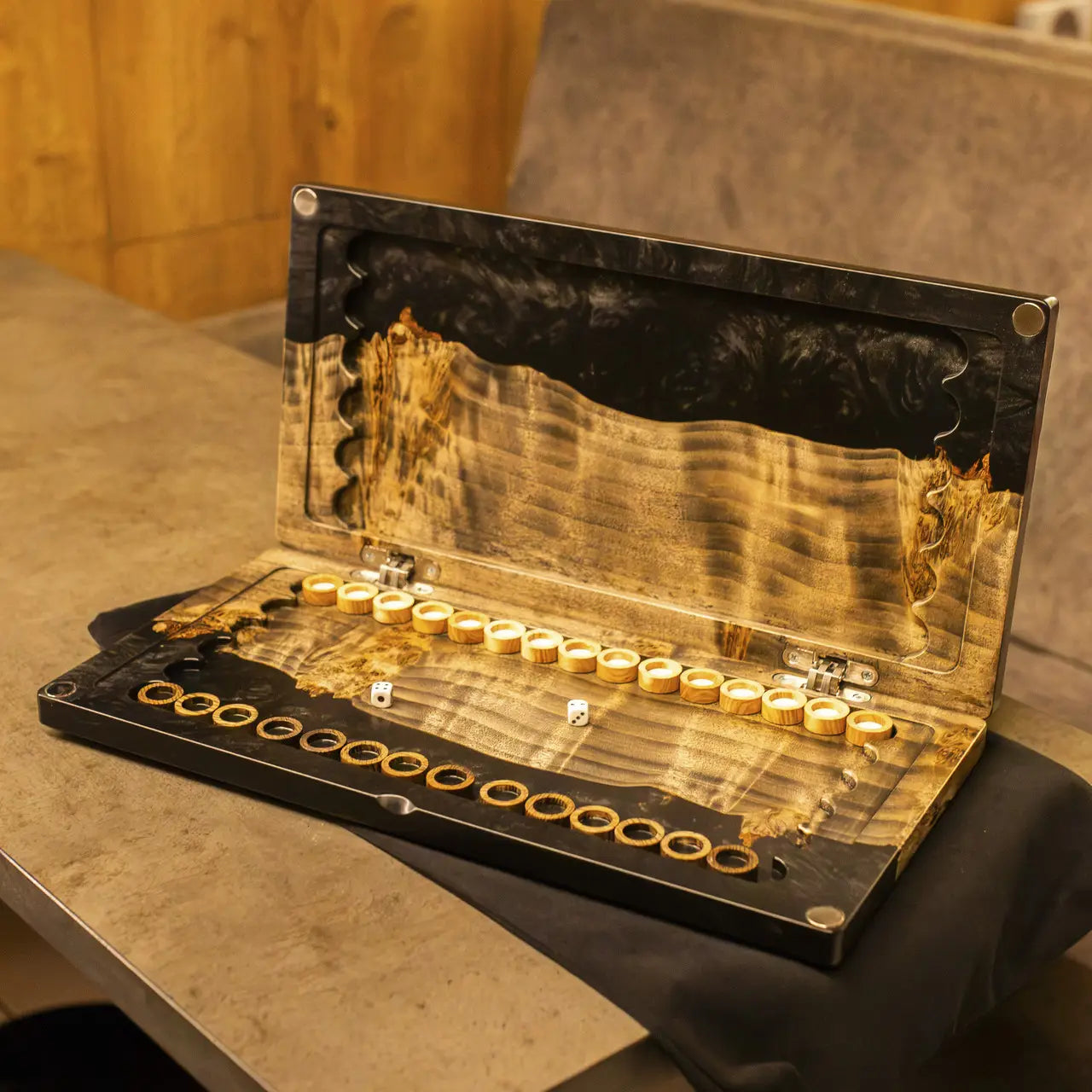 Open premium Obsidian backgammon board with wooden checkers and dice