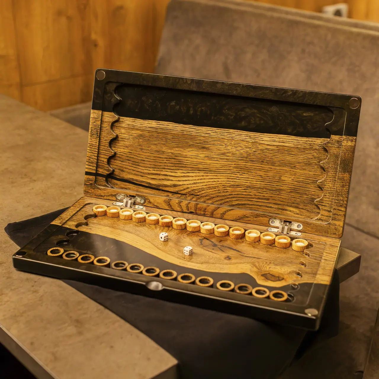 Noir handmade wooden backgammon checkers on natural wood and black epoxy resin board