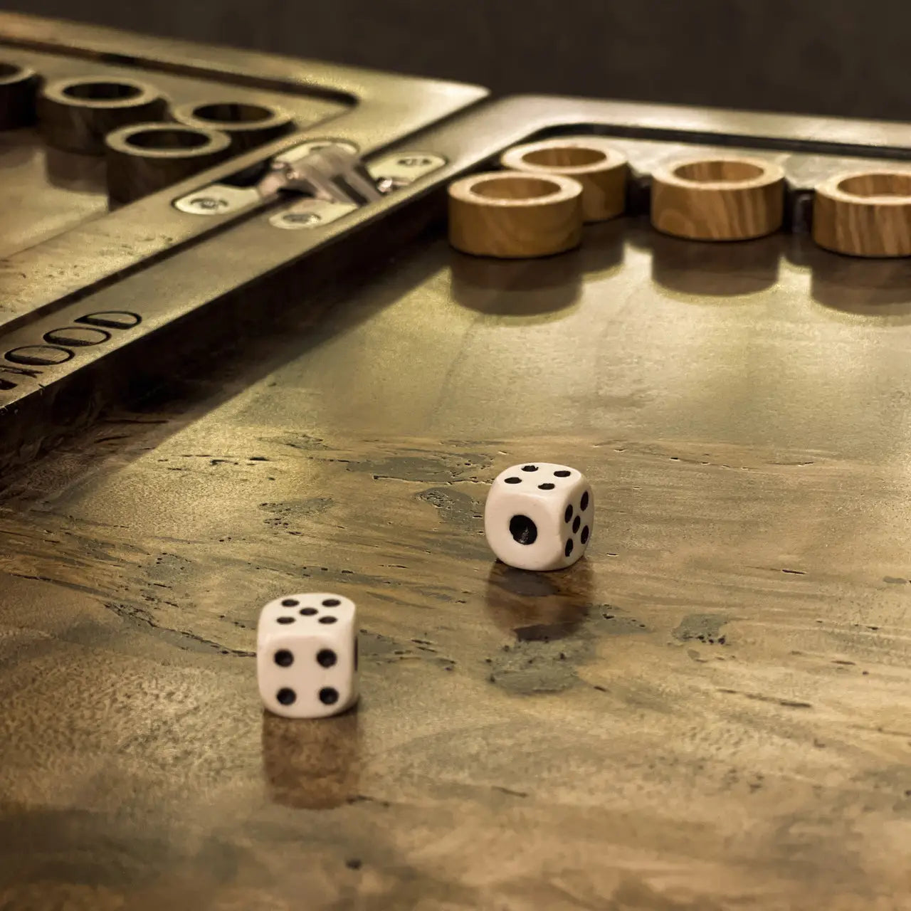 Wildwood backgammon board detail with wooden checkers and playing dice