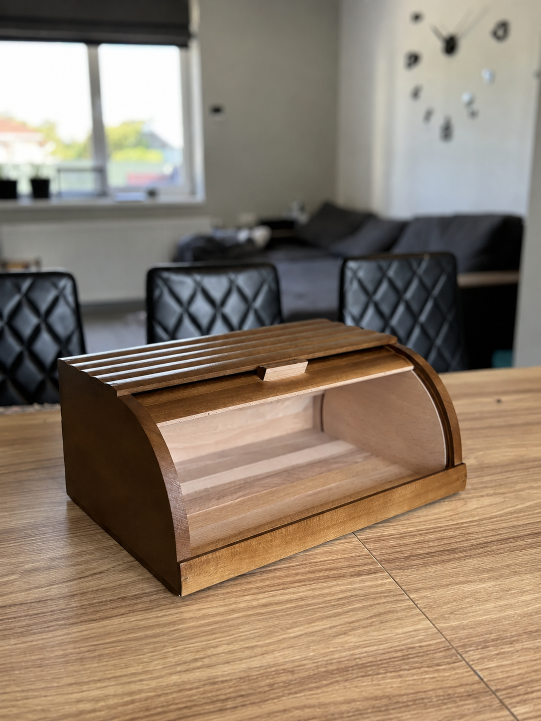 Brown wooden bread box for storing bread and pastries