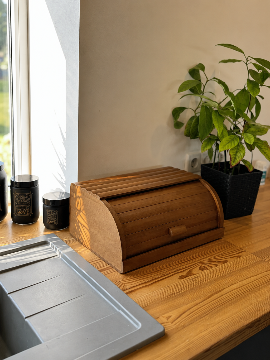 Traditional roll-top bread bin crafted from natural beech wood