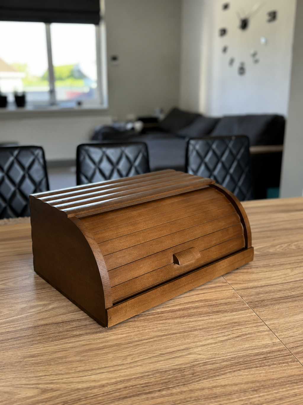 Open brown wooden bread box with spacious interior storage