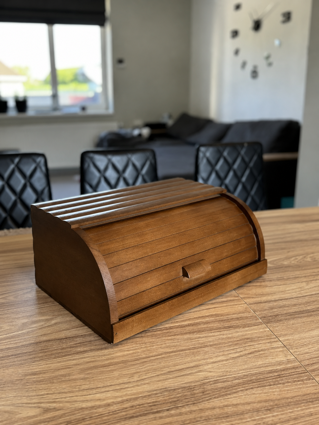 Open brown wooden bread box with spacious interior storage