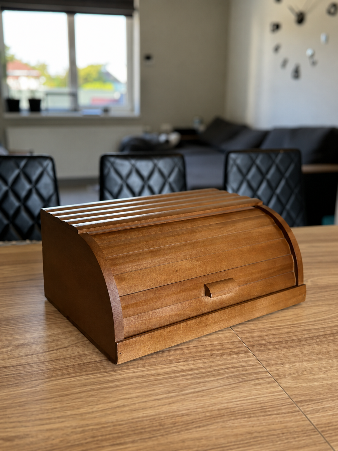 Brown wooden bread box with roll-top lid made from natural beech wood