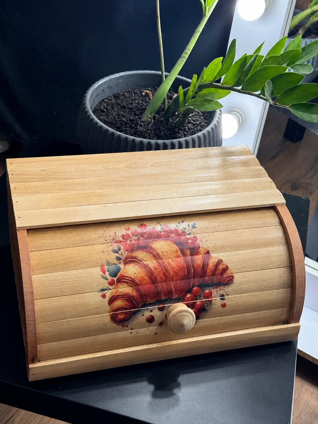 Handcrafted bread storage box made from beech wood with croissant print