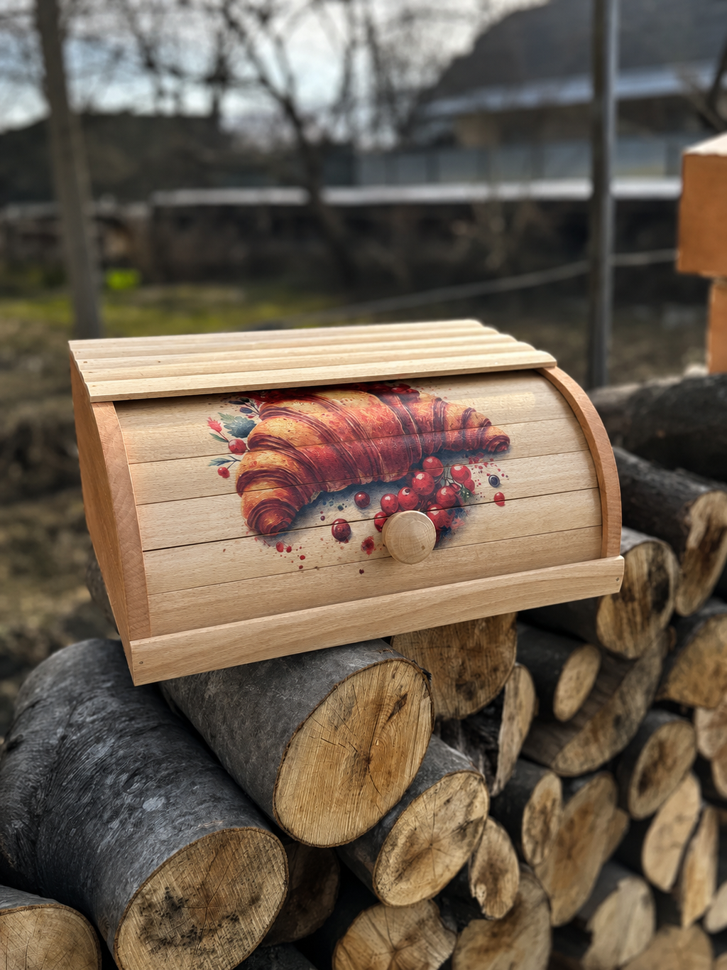 Roll top wooden bread box with croissant illustration