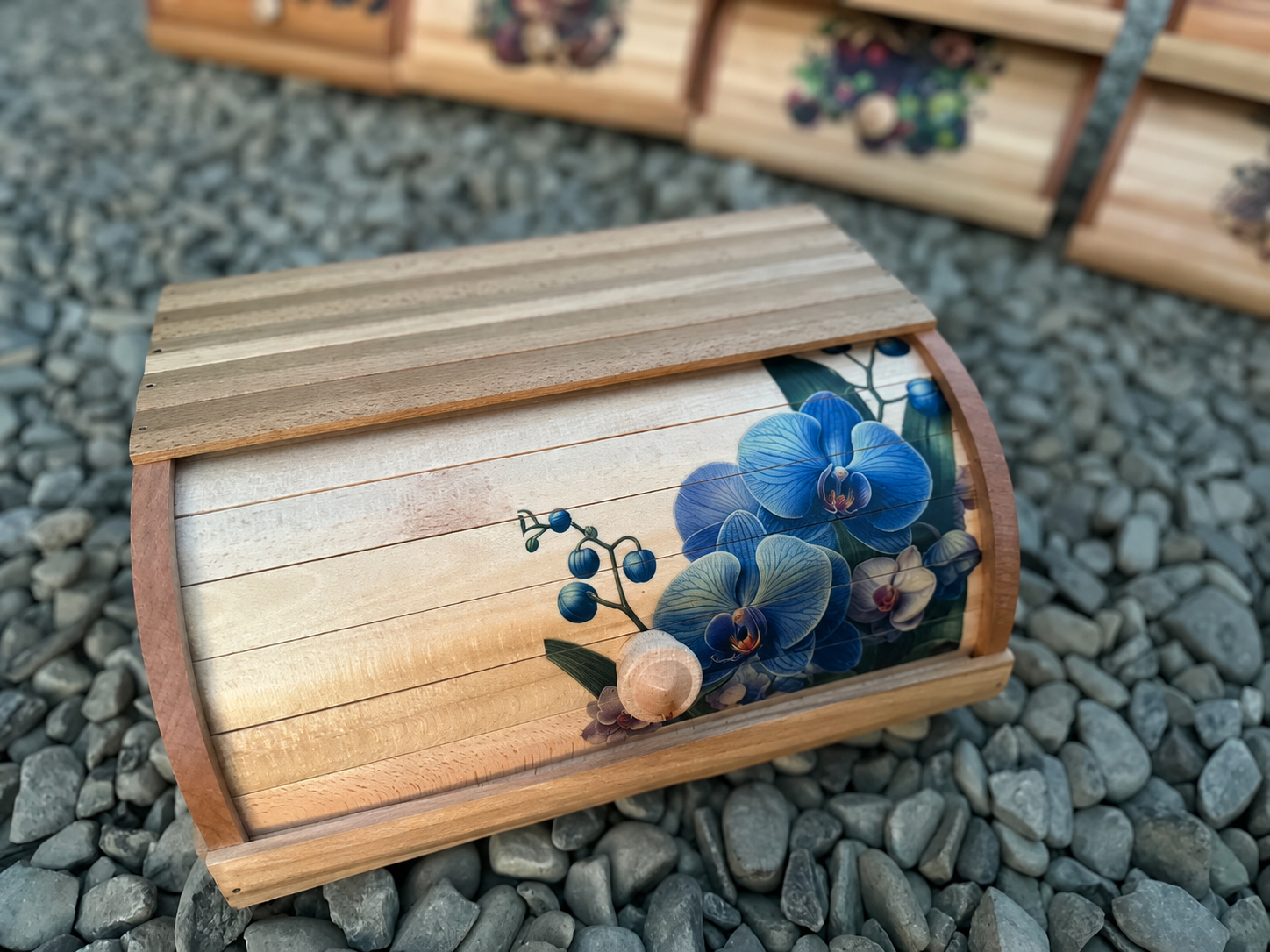 Wooden roll top bread box featuring elegant blue orchids