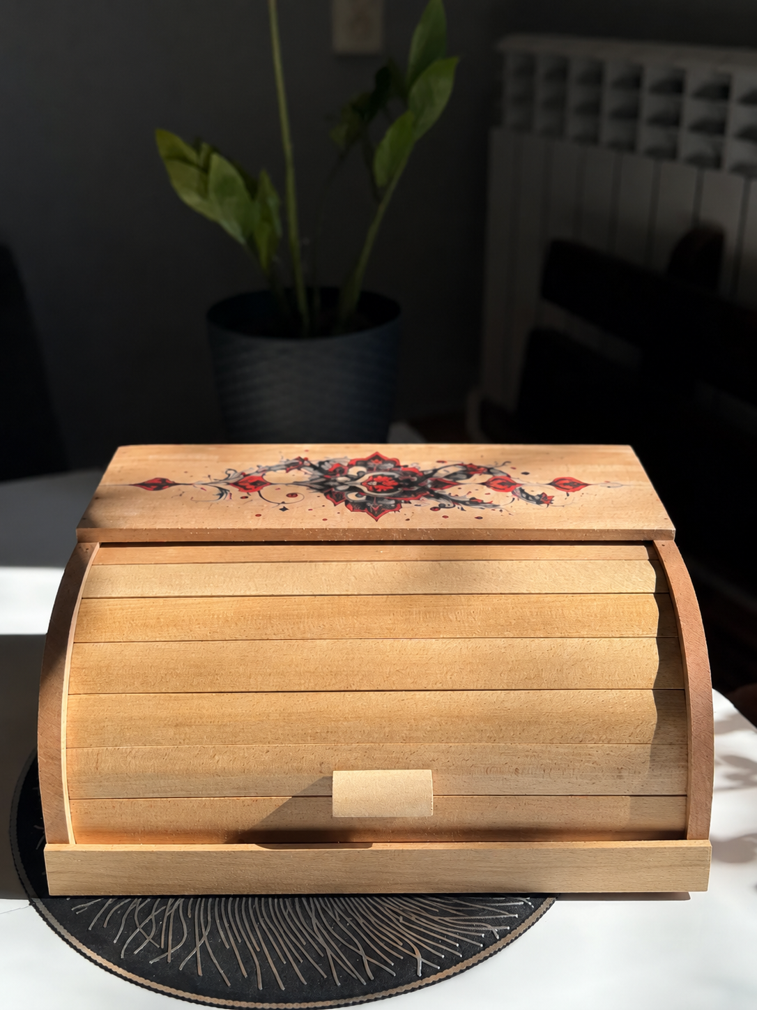 Handmade beech wood bread bin with artistic ornament