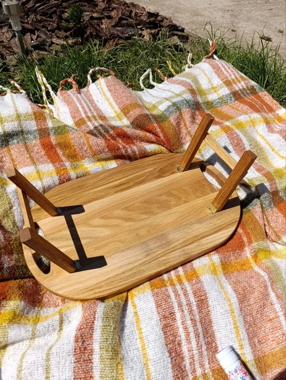 Oak breakfast table shown upside down with wooden legs