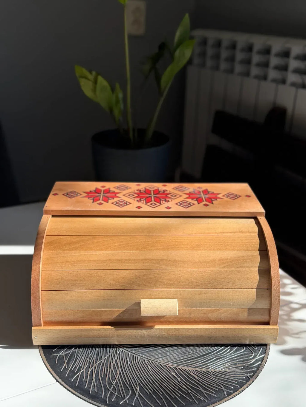 Wooden bread box with traditional Ukrainian ornament
