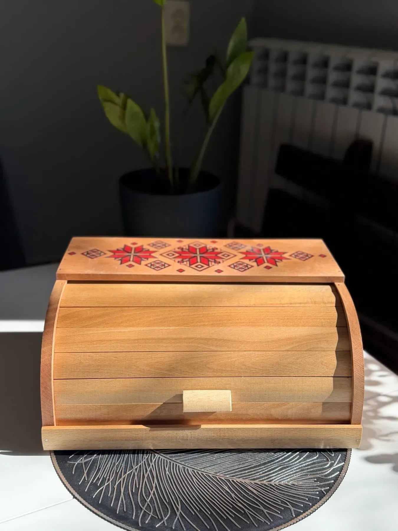 Wooden bread box with traditional Ukrainian ornament