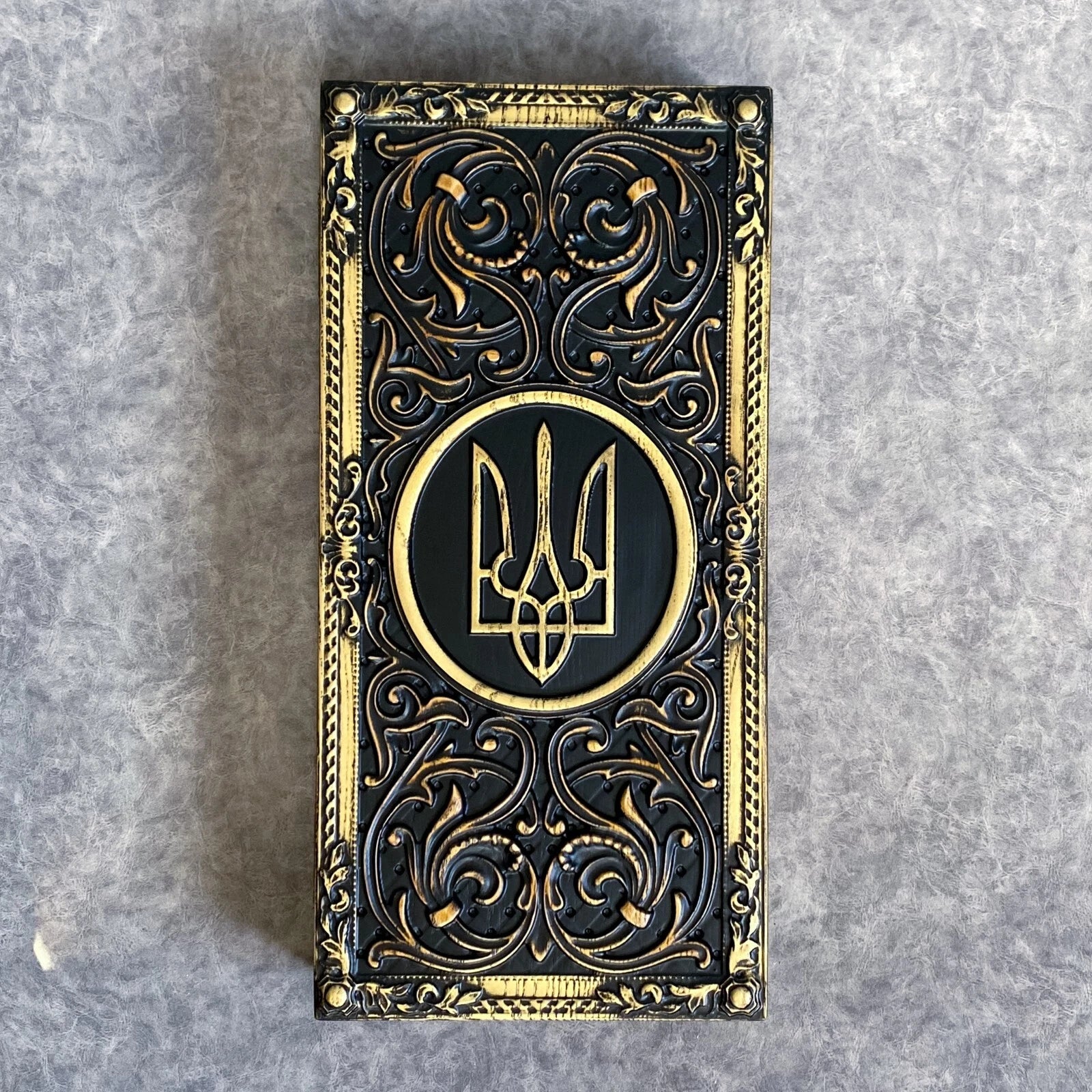 Luxury handcrafted backgammon board with Ukrainian Tryzub symbol, ornate carved wood cover