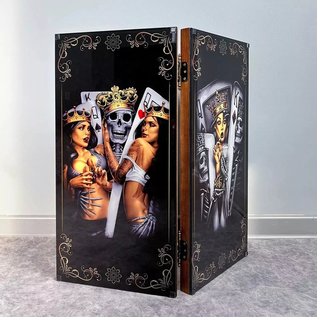 Luxury wooden backgammon set with black glass panels showing royal card characters, skulls, and ornate decorative patterns