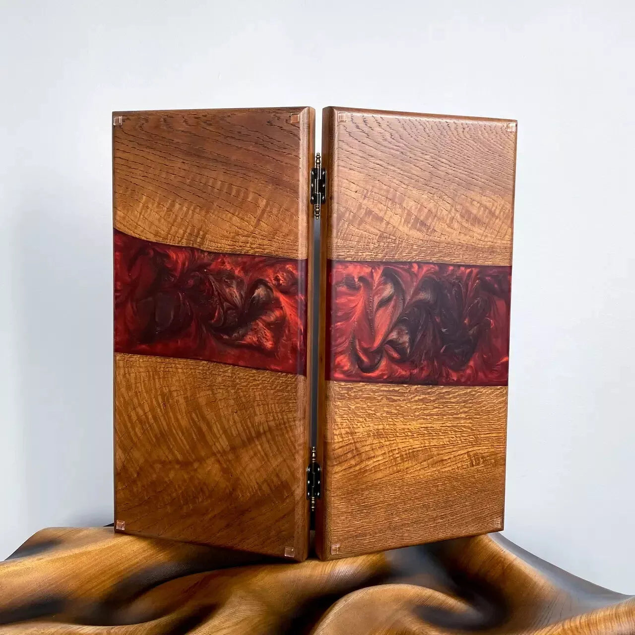 Luxury handcrafted wooden backgammon board featuring red epoxy resin and natural wood texture