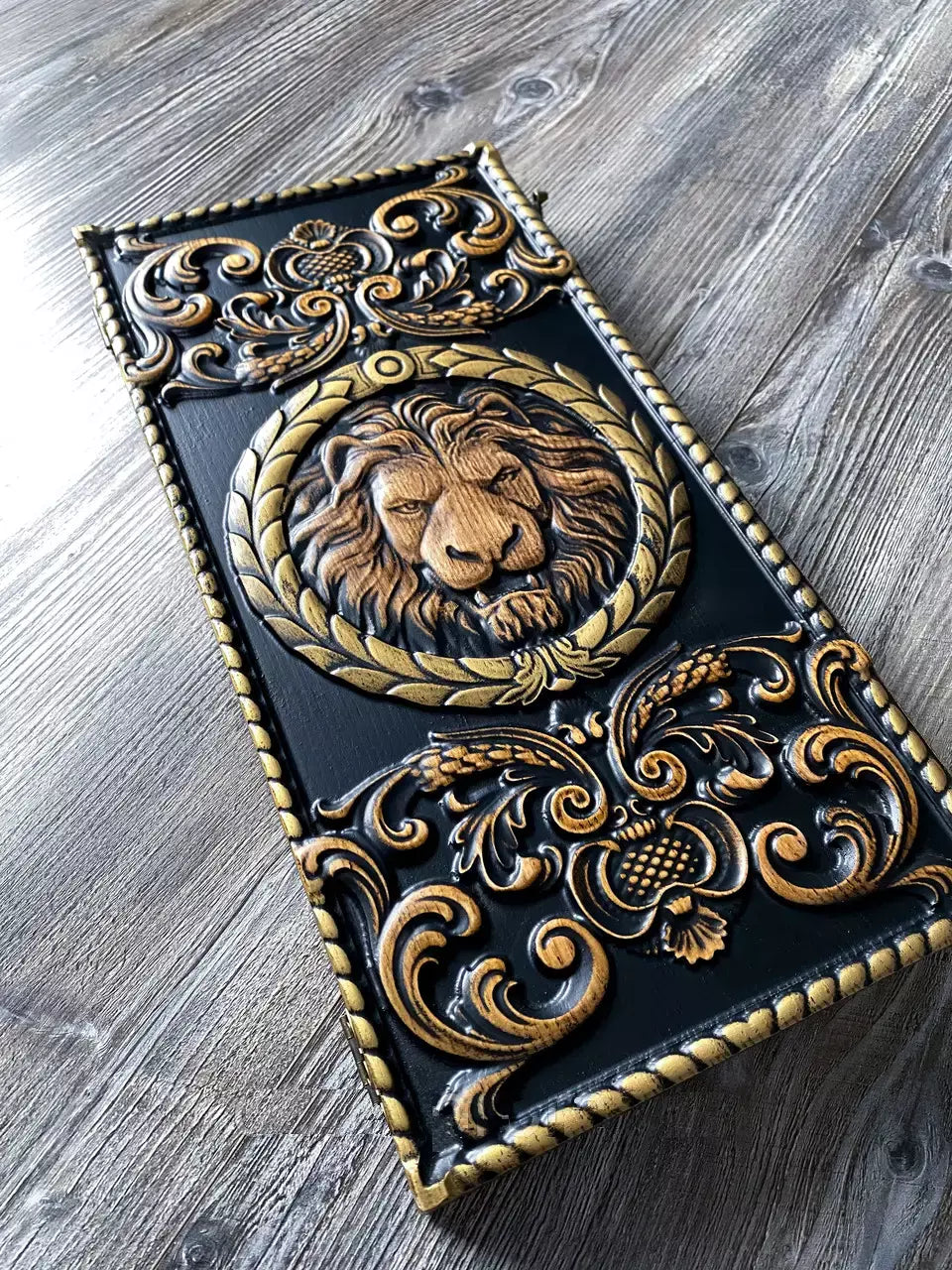Premium wooden backgammon set with embossed lion motif and intricate ornamental carvings.
