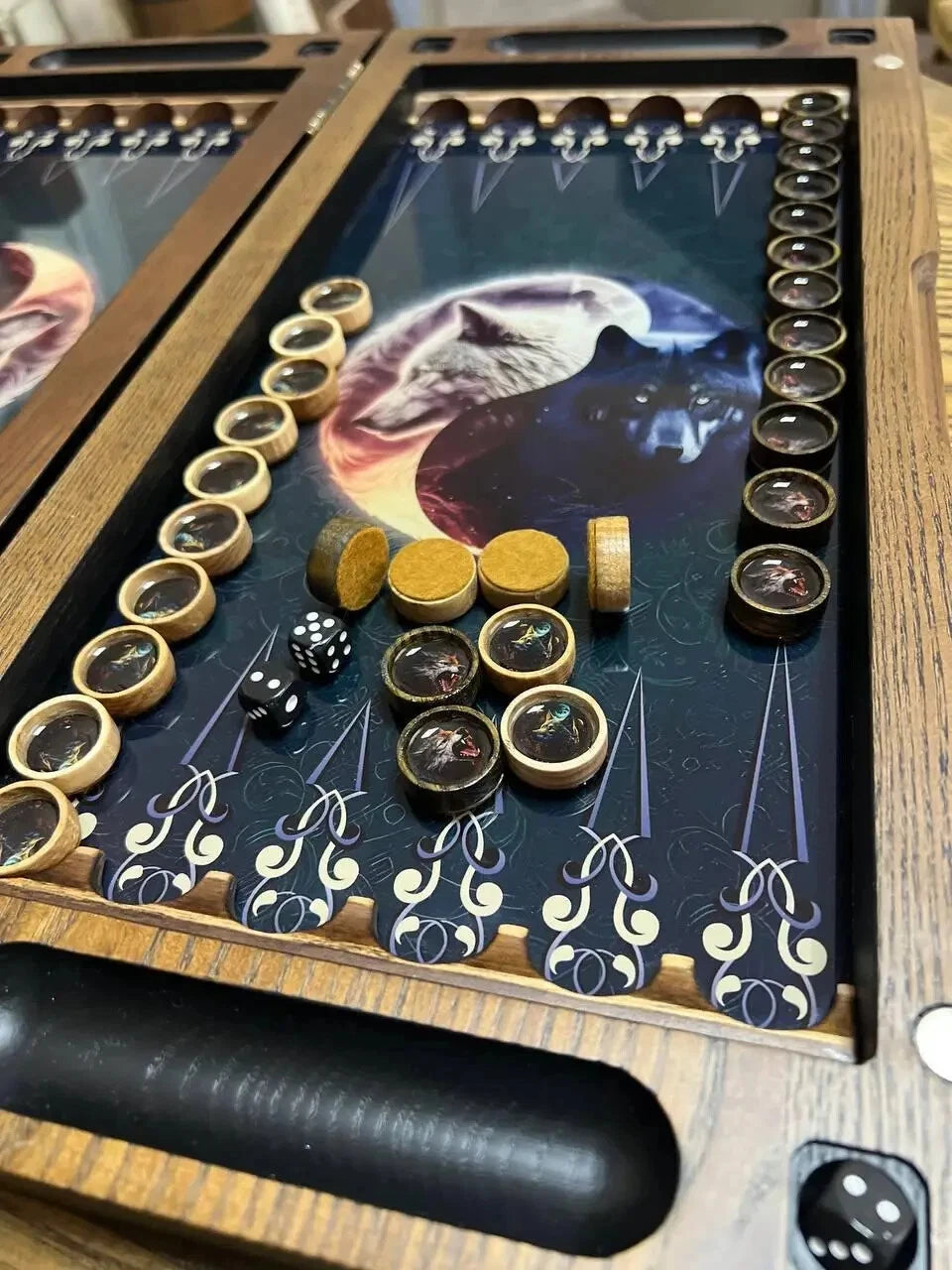 Handcrafted wooden backgammon set with yin yang wolf design, epoxy-coated playing field, detailed game pieces and dice close-up