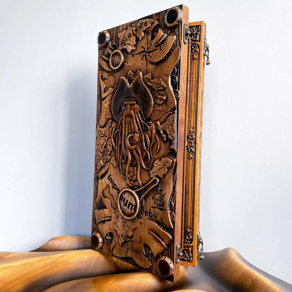 Handcrafted wooden backgammon board featuring a detailed Davy Jones pirate engraving with nautical elements.