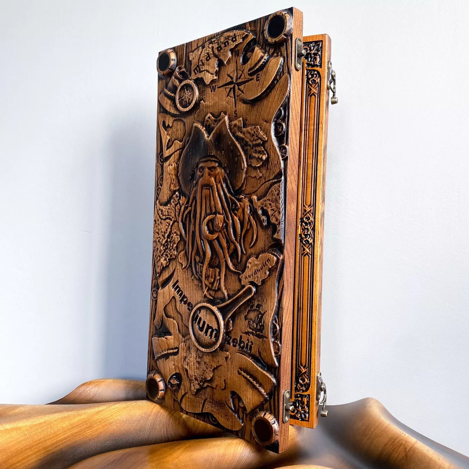 Handcrafted wooden backgammon board featuring a detailed Davy Jones pirate engraving with nautical elements.