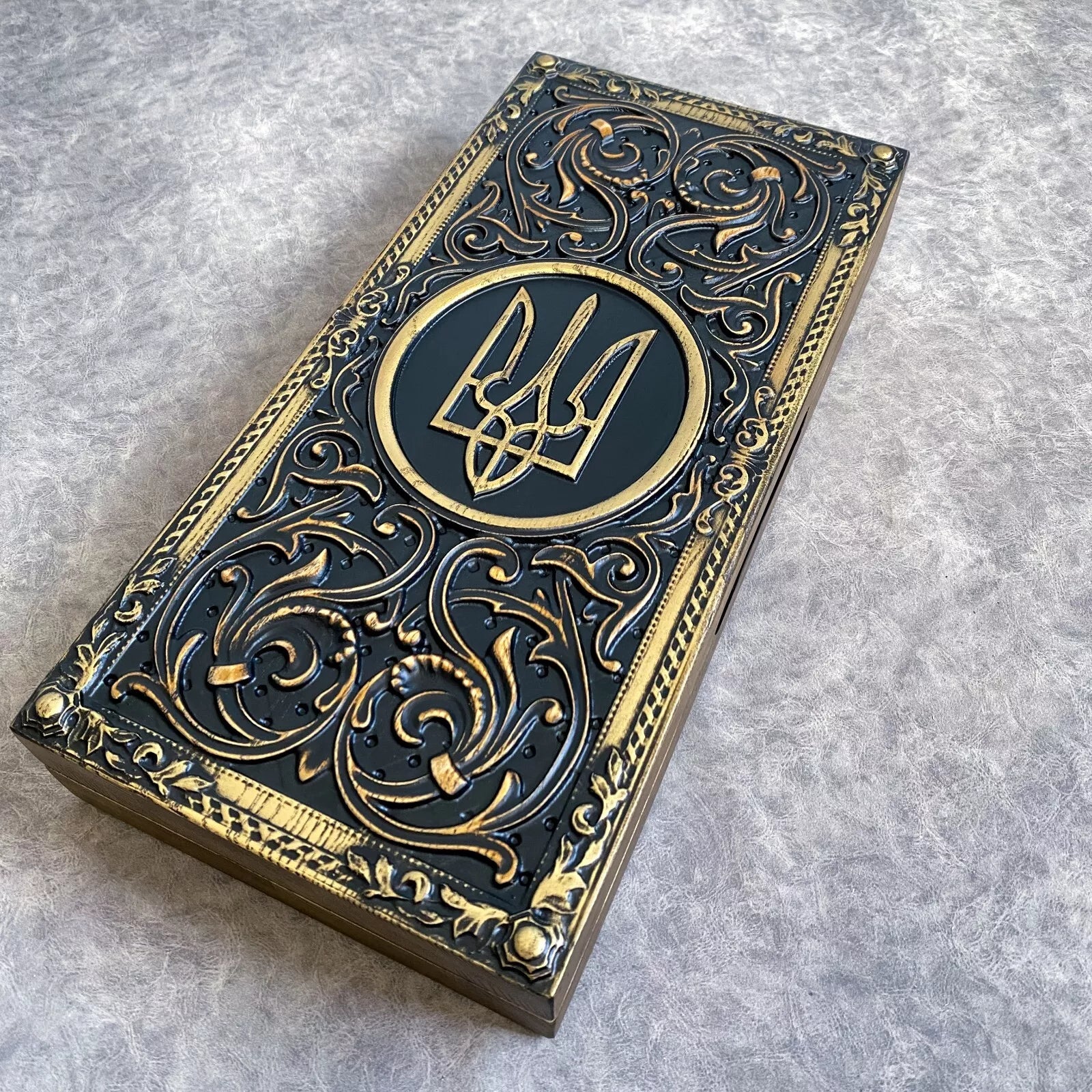 Closed wooden backgammon set with Ukrainian trident emblem, carved ash wood exterior
