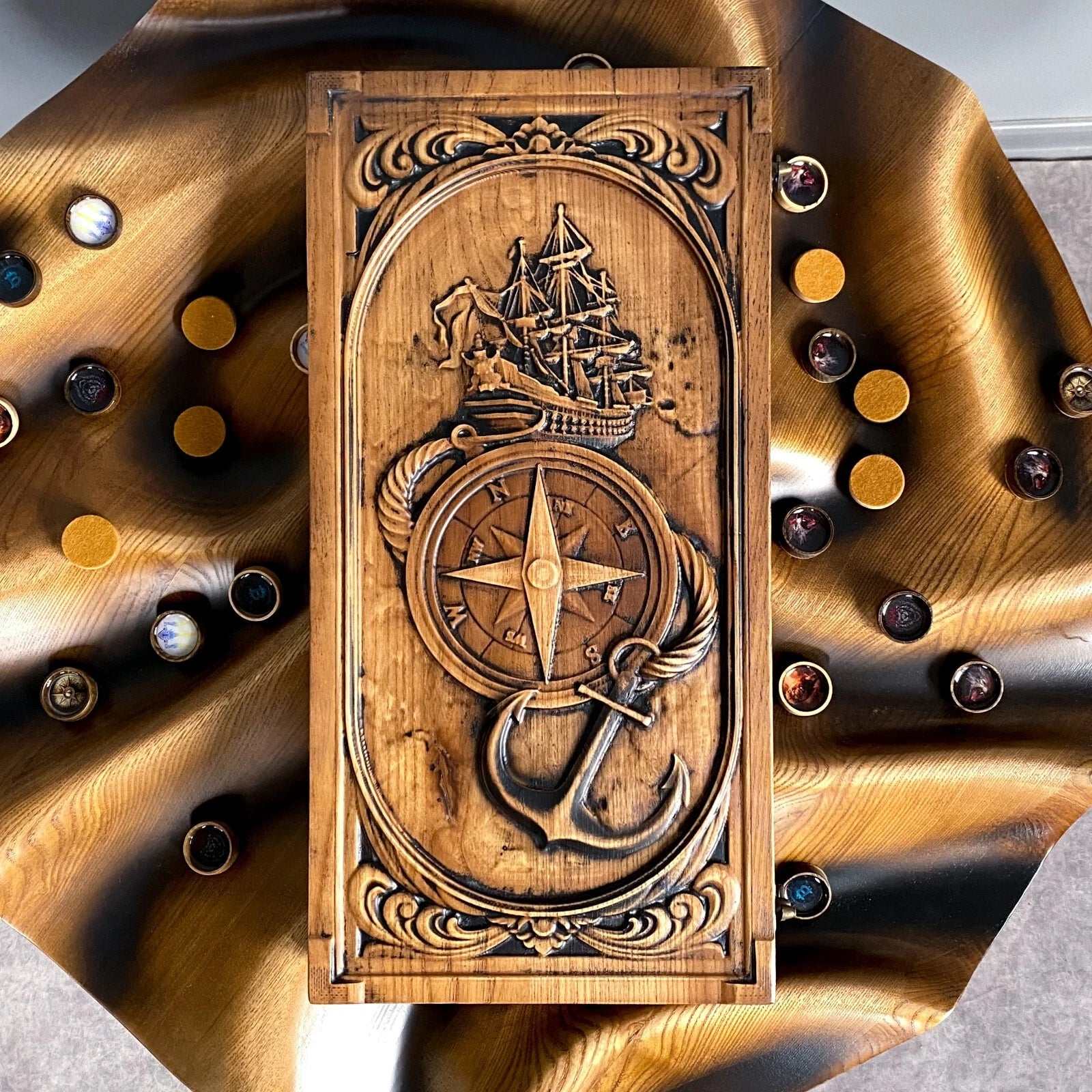 Handcrafted ash wood backgammon set featuring ship, anchor, and compass engravings on the front panel.
