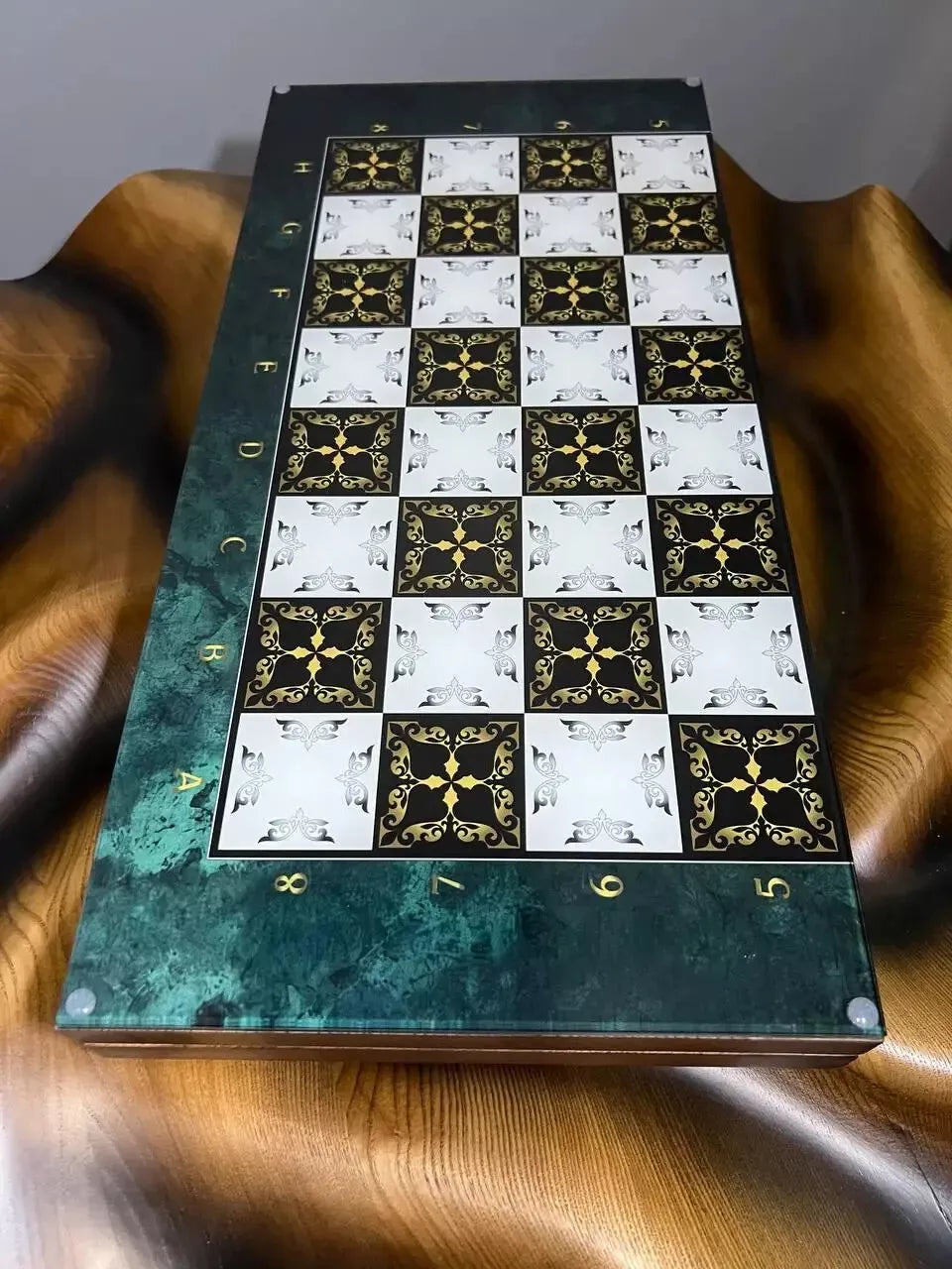 Glass chess board with decorative black and white squares, wooden frame