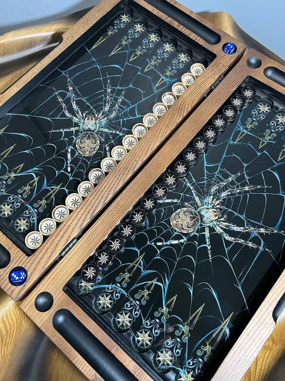 Luxury wooden backgammon board interior featuring dark spider web design and detailed playing field