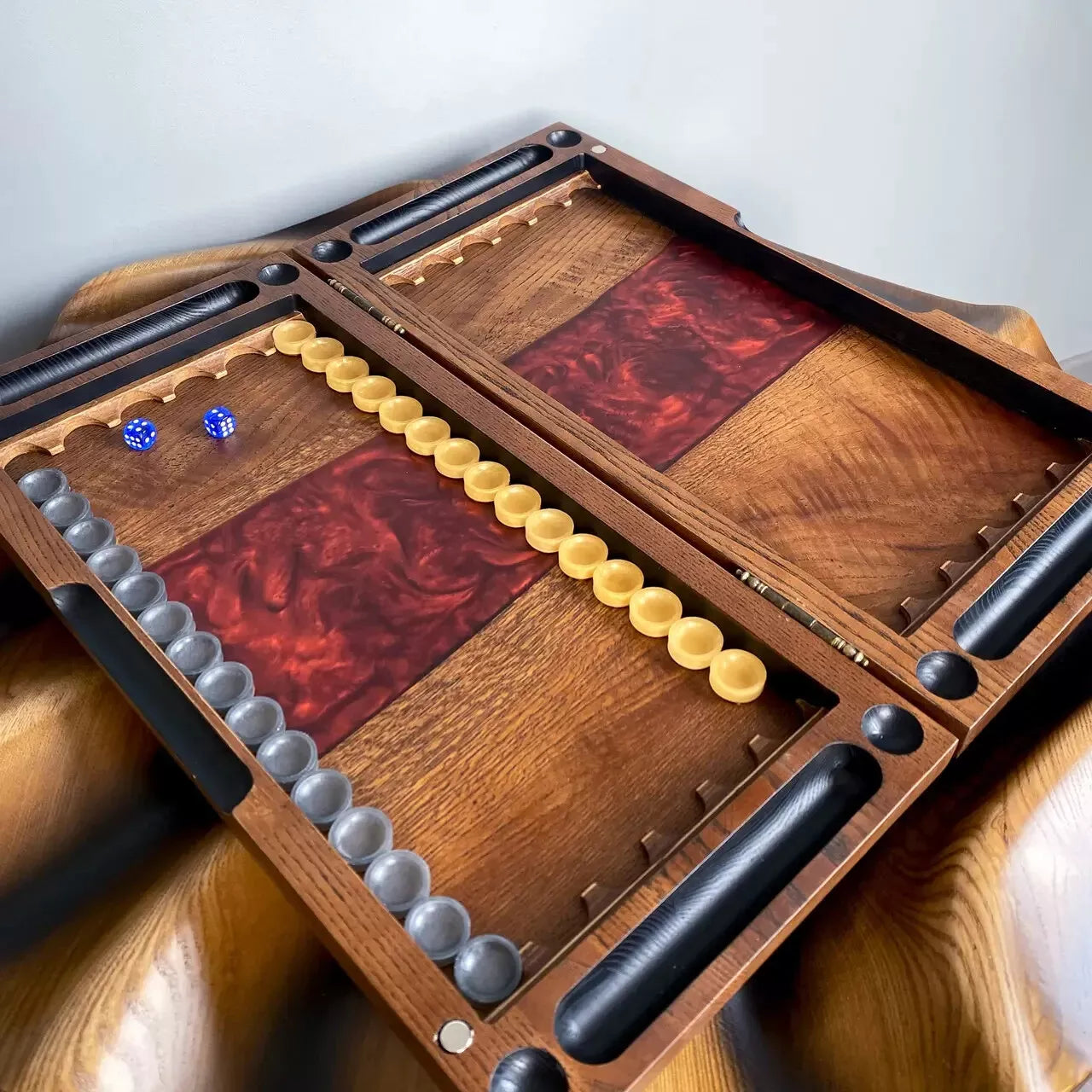 Open wooden backgammon set with red epoxy resin inlay, smooth playing surface and wooden checkers