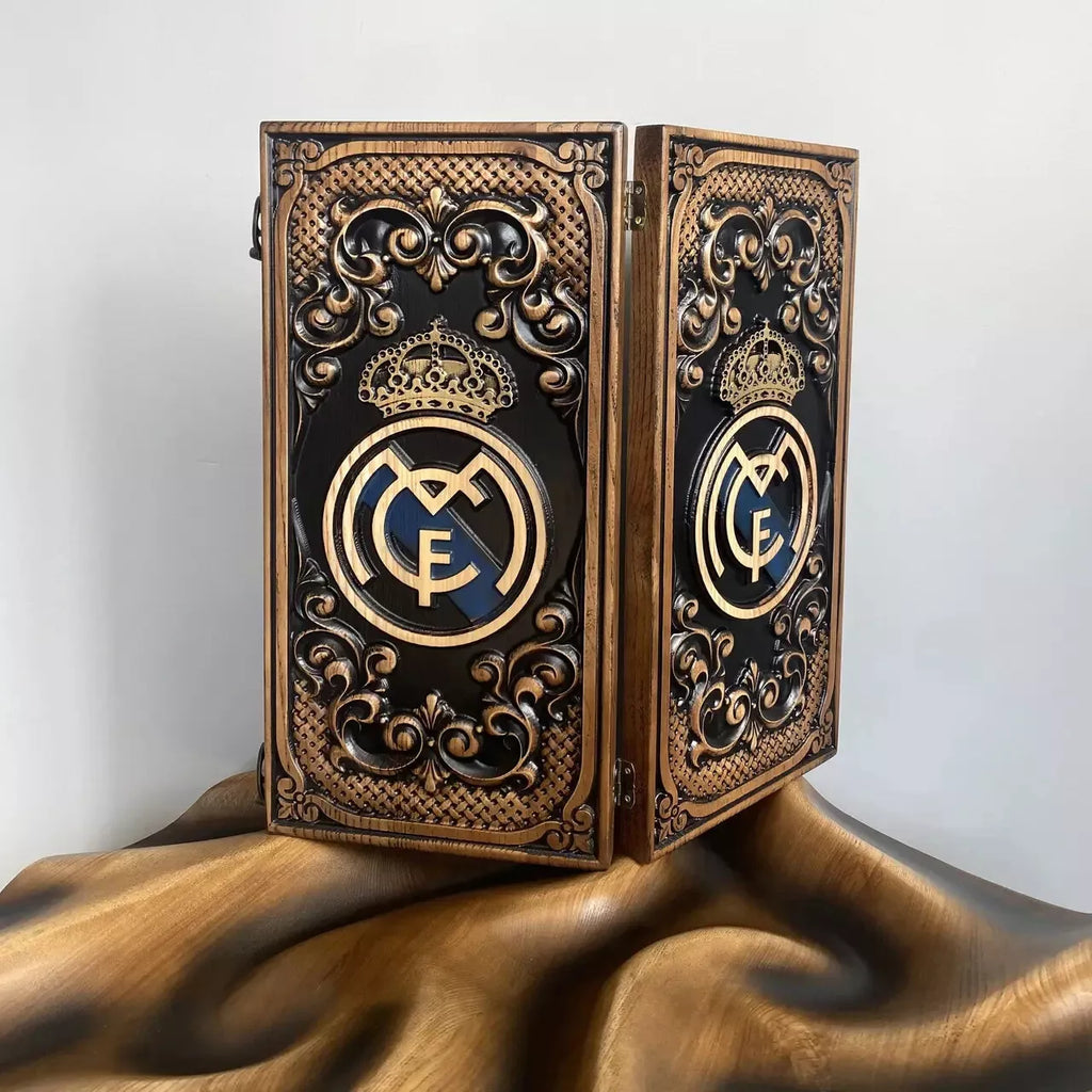 Decorative carved wood backgammon set featuring an intricate crest design with crown and ornamental patterns.