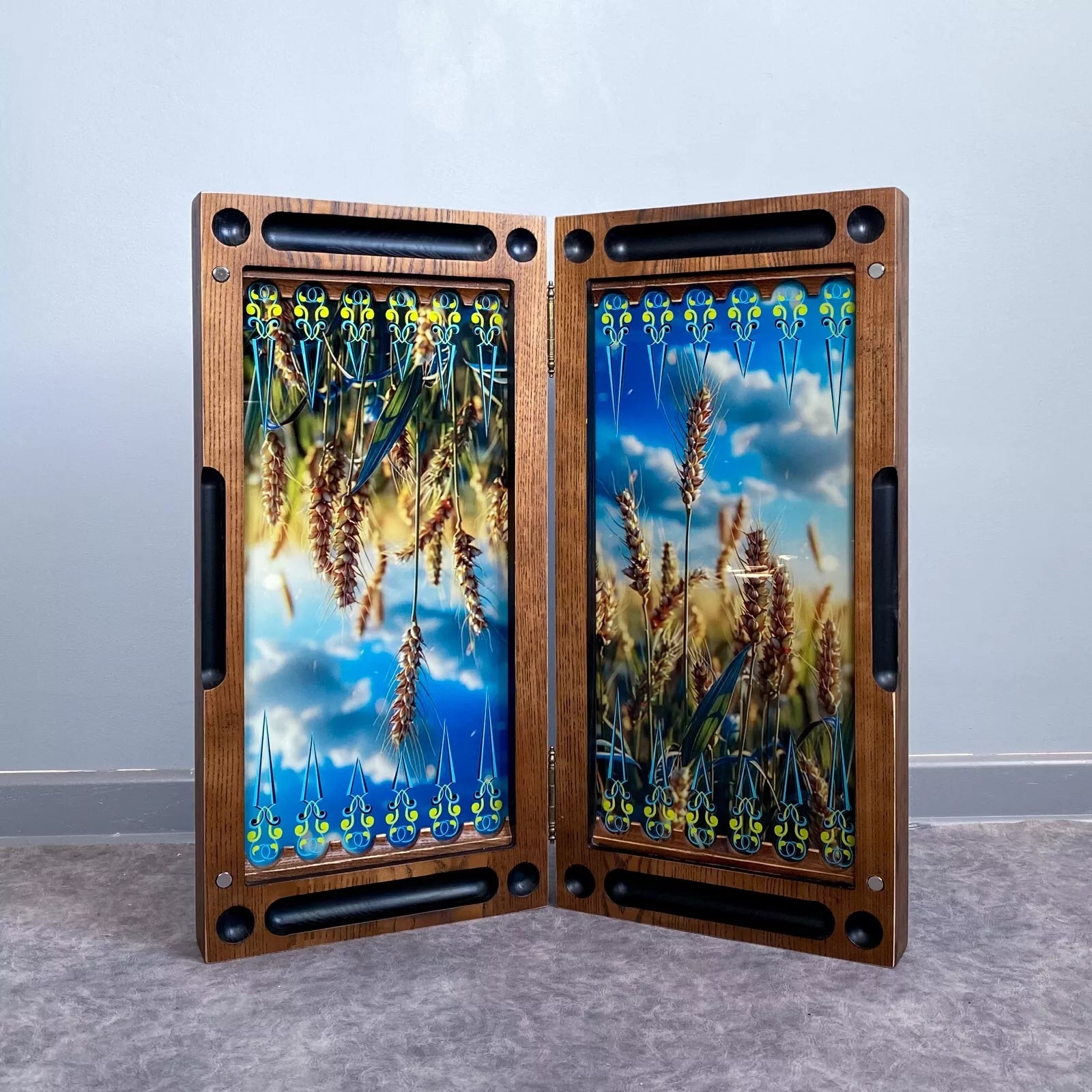 Handcrafted wooden backgammon board with Ukrainian wheat field design under tempered glass, open view