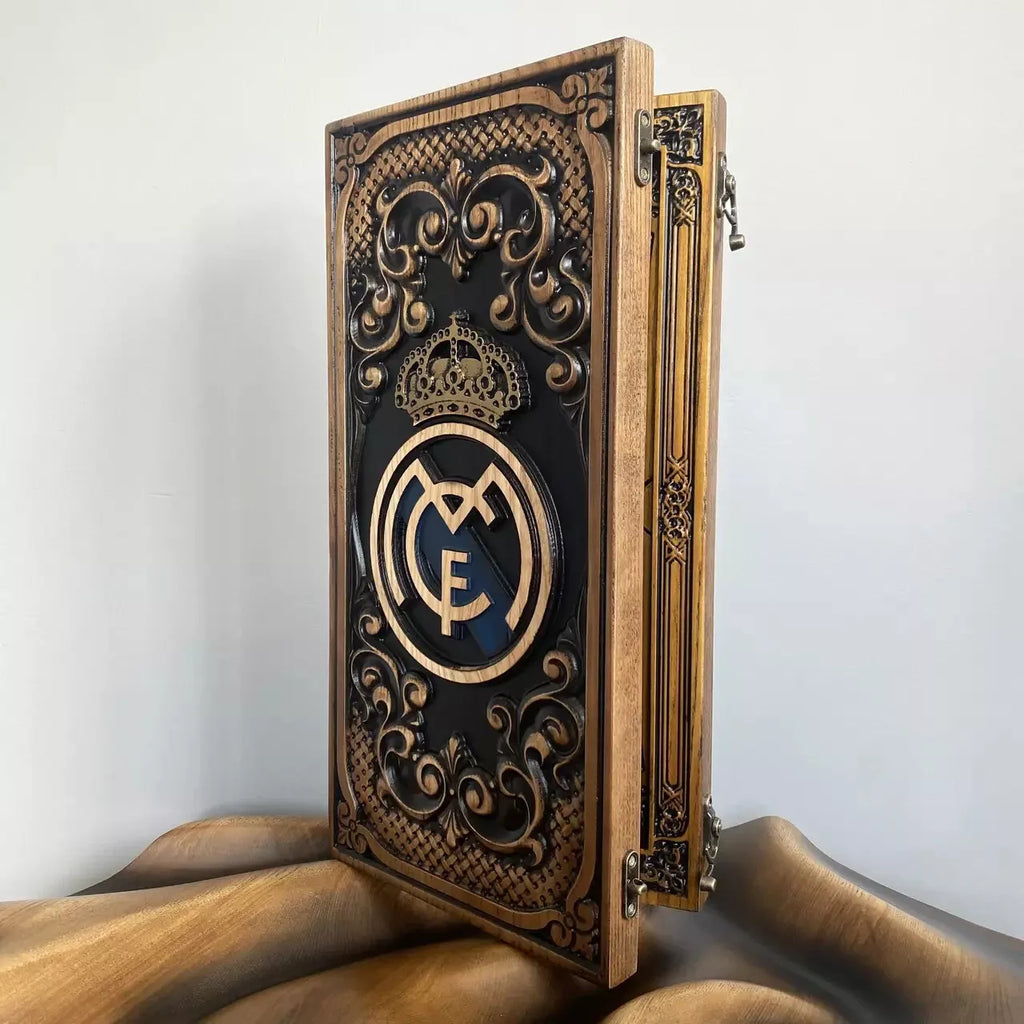 Decorative carved wood backgammon case featuring a crown and crest design with elegant ornamental details.