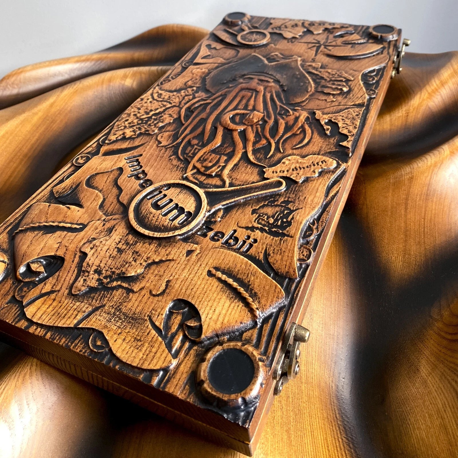 Handmade backgammon case featuring a detailed pirate-themed engraving inspired by Davy Jones.