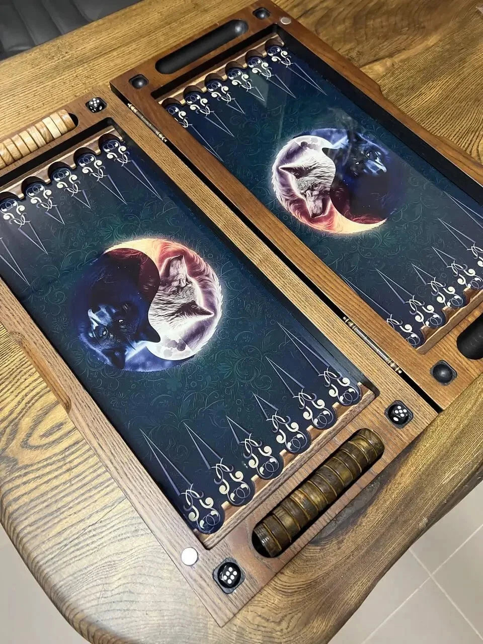 Handcrafted wooden backgammon set with wolf and moon design, open board view