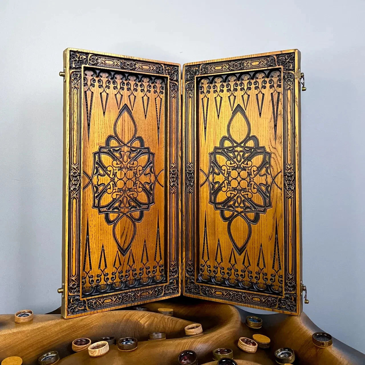 Handmade ash wood backgammon board interior with carved ornament design, open playing field view