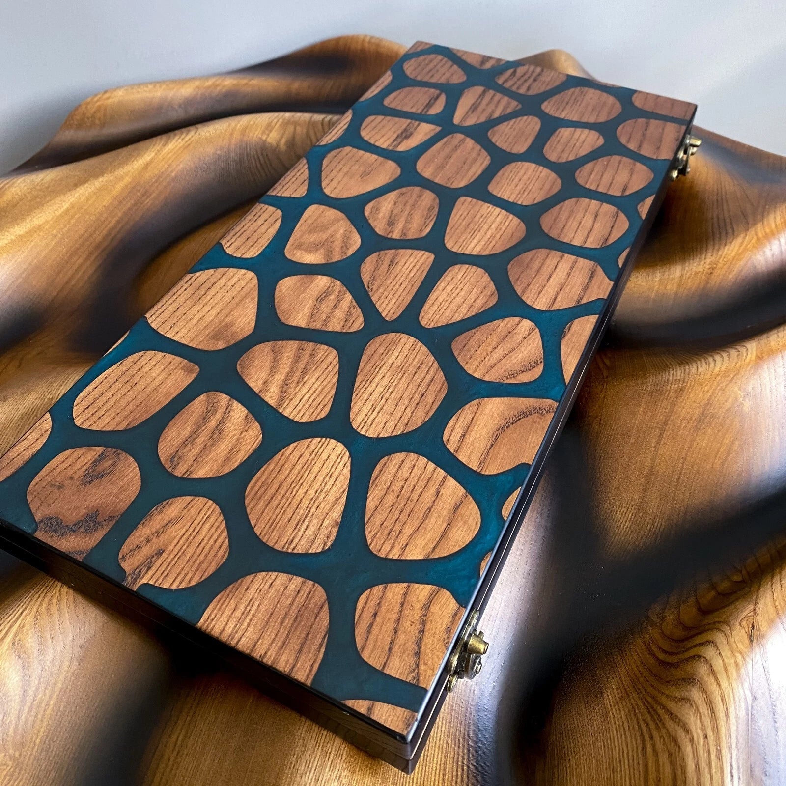 Top view of handmade ash wood backgammon set with abstract mosaic resin pattern