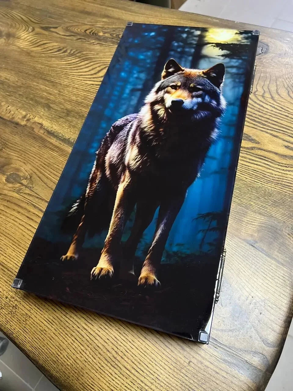 Wooden backgammon case with realistic wolf illustration in dark forest background