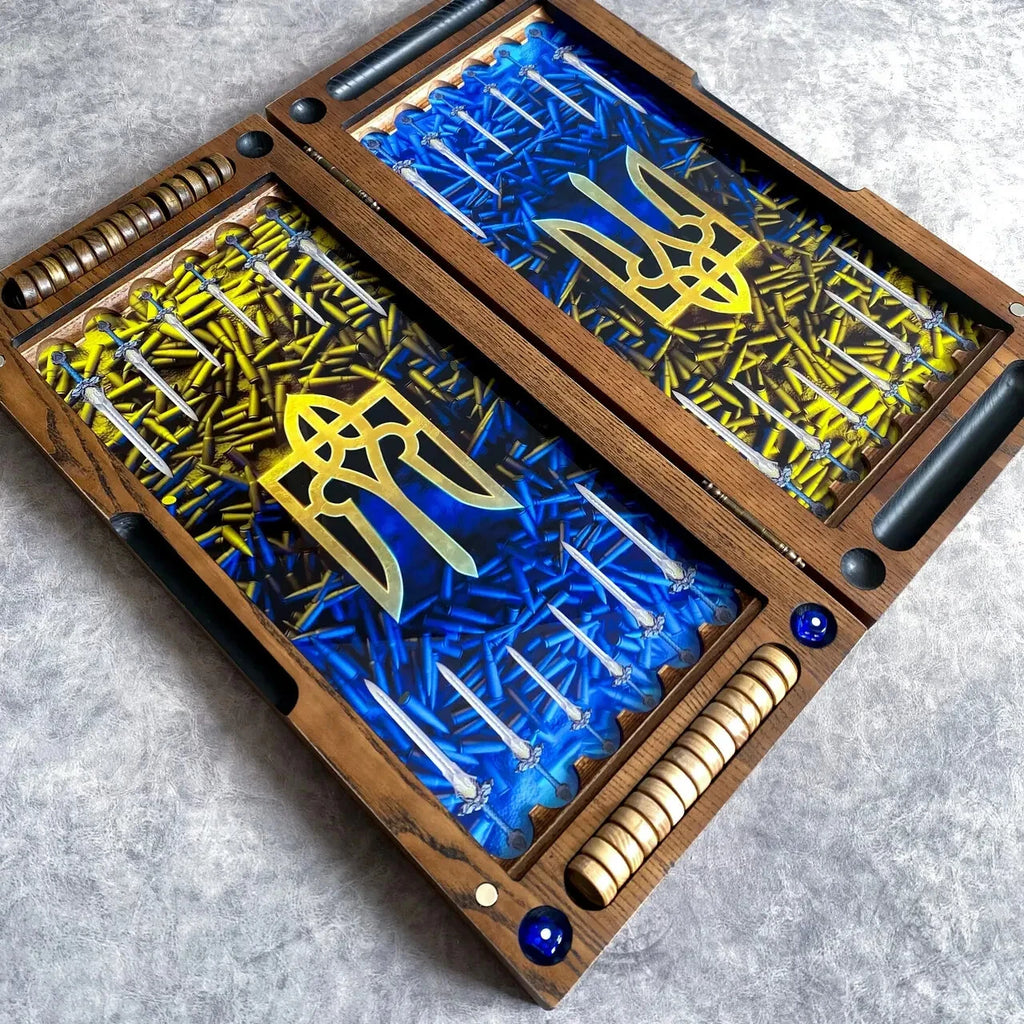 Open wooden backgammon set with Ukrainian trident symbol, blue and yellow design, decorative bullets and carved wood frame